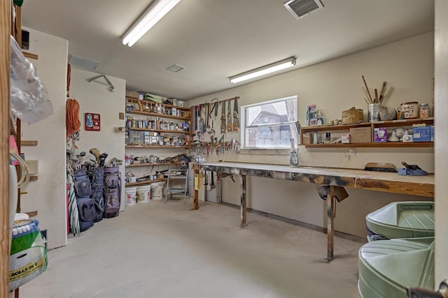 interior space with visible vents and a workshop area