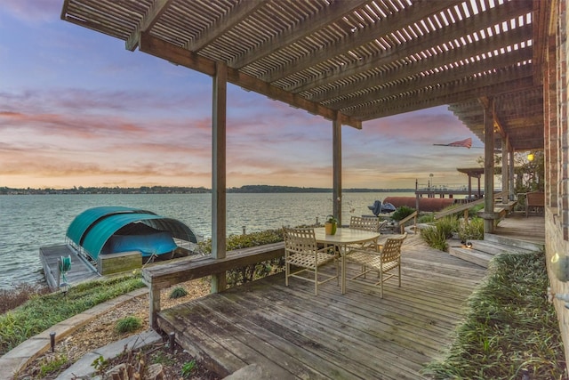 view of dock featuring a pergola and a water view