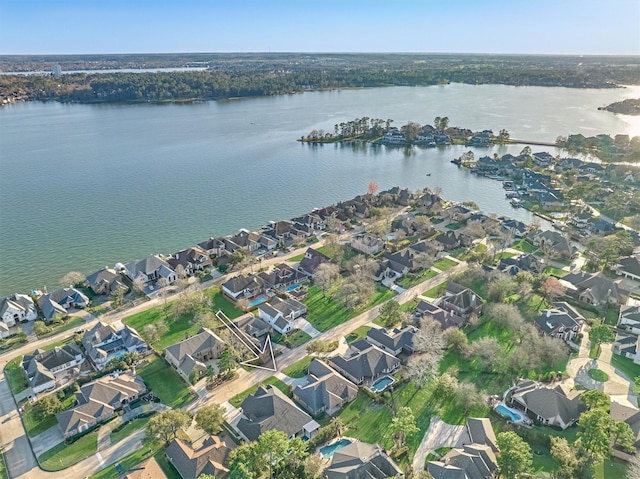 drone / aerial view featuring a residential view and a water view