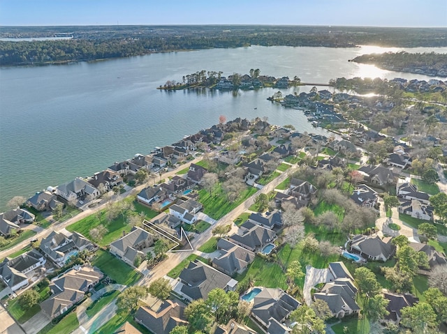 bird's eye view featuring a residential view and a water view