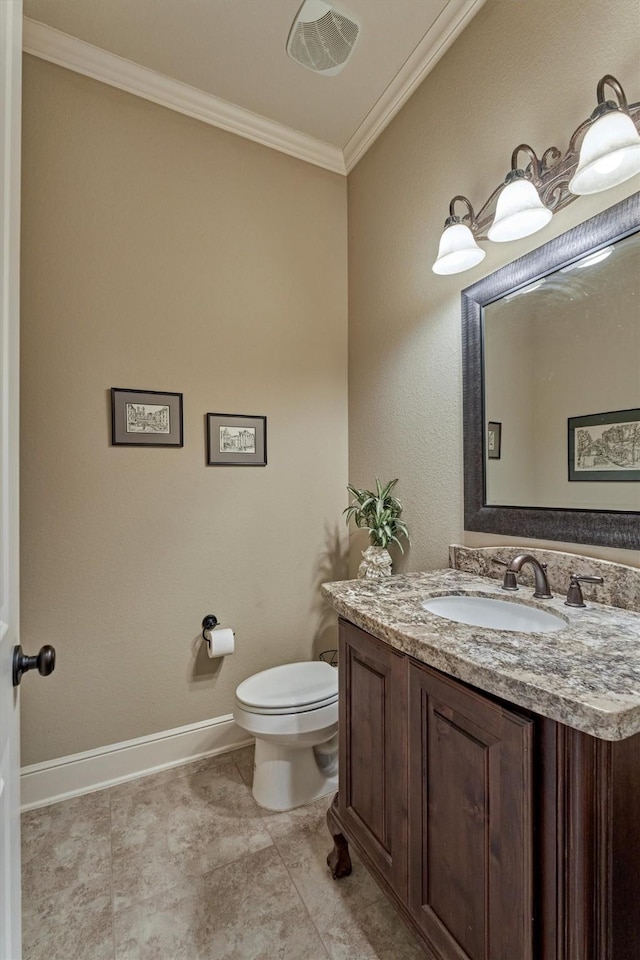 bathroom with visible vents, toilet, crown molding, baseboards, and vanity