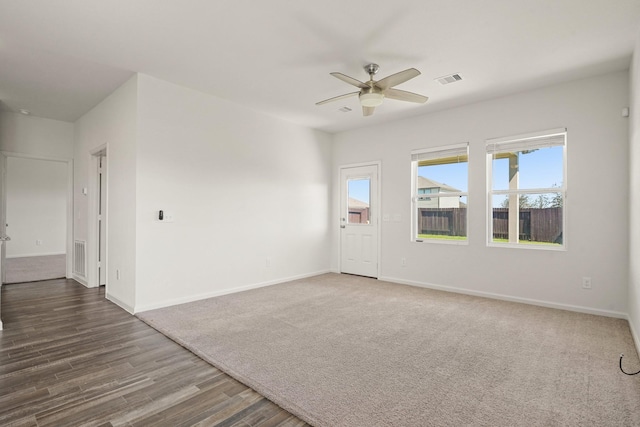 unfurnished living room featuring visible vents, ceiling fan, and baseboards