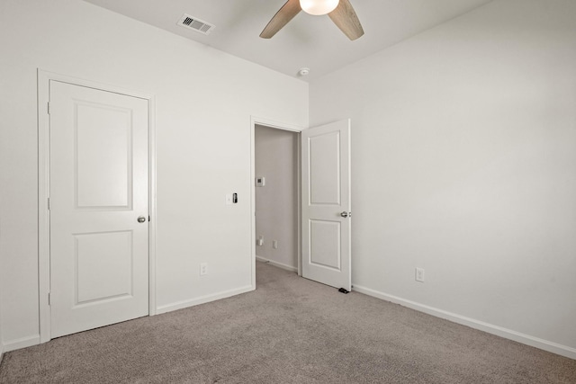 unfurnished bedroom featuring carpet flooring, baseboards, and visible vents