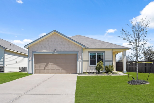 single story home with board and batten siding, central air condition unit, concrete driveway, a front yard, and a garage