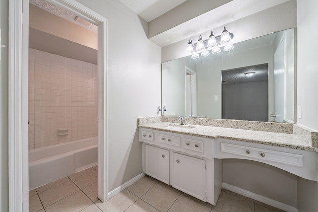 full bathroom with tile patterned flooring, vanity, shower / tub combination, and baseboards