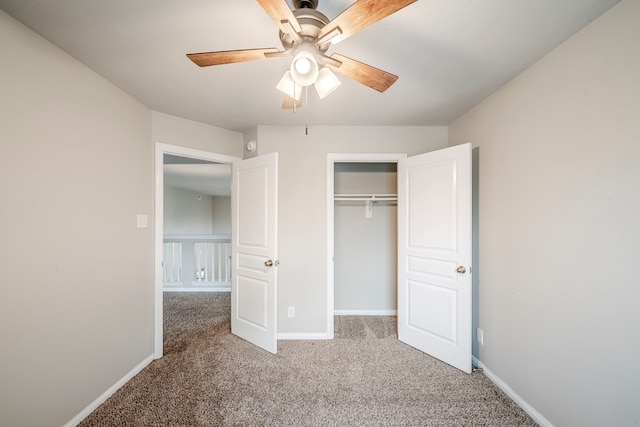 unfurnished bedroom with a closet, baseboards, and carpet