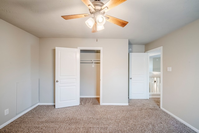 unfurnished bedroom with a ceiling fan, light colored carpet, baseboards, and a closet