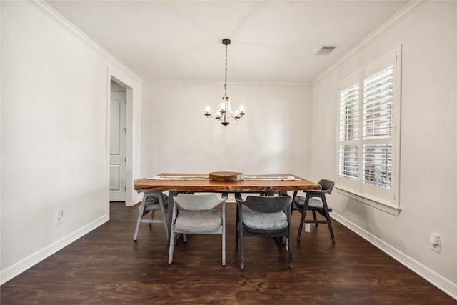 dining area with ornamental molding, wood finished floors, visible vents, and baseboards