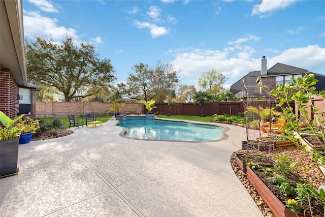 view of pool featuring a garden, a fenced in pool, a patio, and a fenced backyard