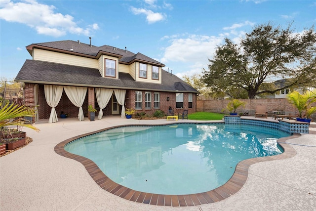 view of swimming pool with a fenced in pool, a patio, and fence