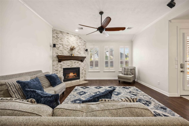 living area with visible vents, wood finished floors, and ornamental molding