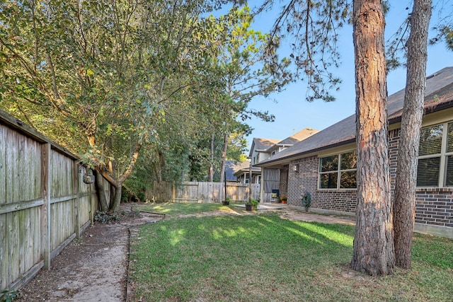 126 Magnolia Grove Ln, Conroe, TX 77384 - view of yard featuring a fenced backyard