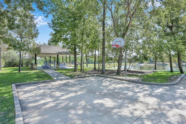 126 Magnolia Grove Ln, Conroe, TX 77384 - view of basketball court featuring community basketball court, a yard, and a water view