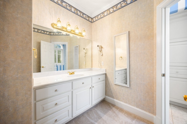 bathroom featuring baseboards, ornamental molding, vanity, and wallpapered walls