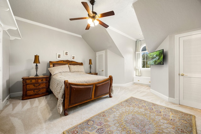 bedroom featuring lofted ceiling, light colored carpet, baseboards, and a textured ceiling