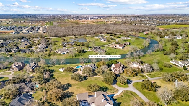 birds eye view of property with a residential view and a water view