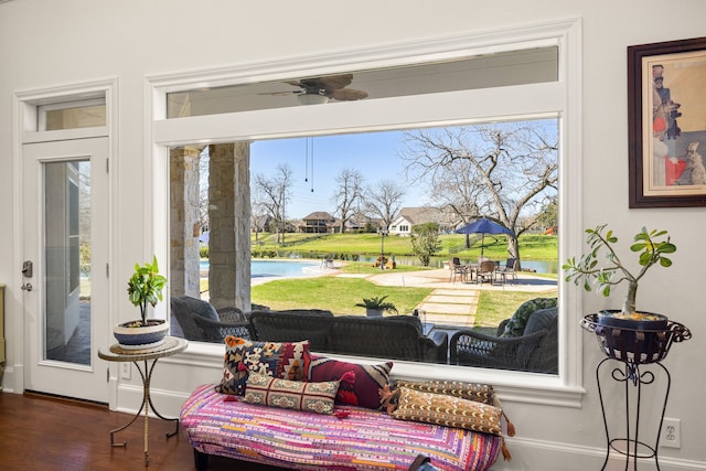 sitting room featuring baseboards and wood finished floors