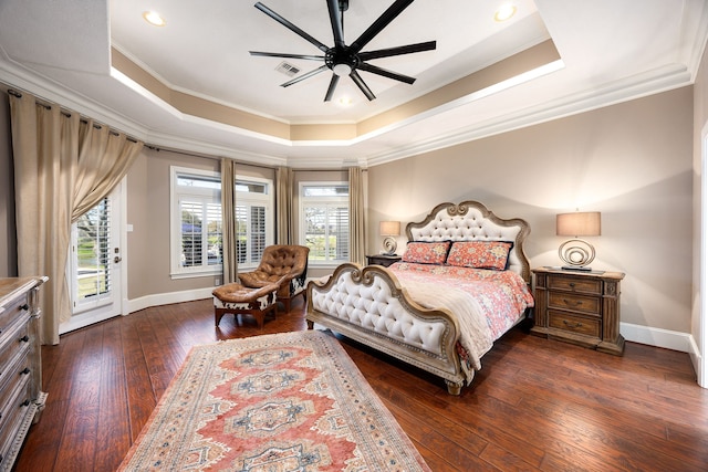 bedroom featuring visible vents, dark wood finished floors, crown molding, a raised ceiling, and access to outside