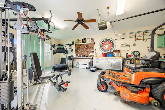 garage with ceiling fan, a workshop area, and a garage door opener