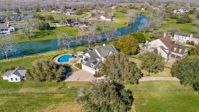 drone / aerial view with a residential view and a water view