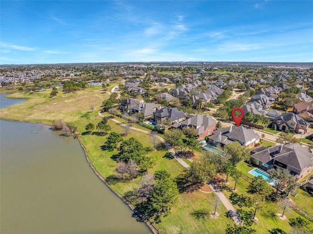 birds eye view of property featuring a residential view and a water view