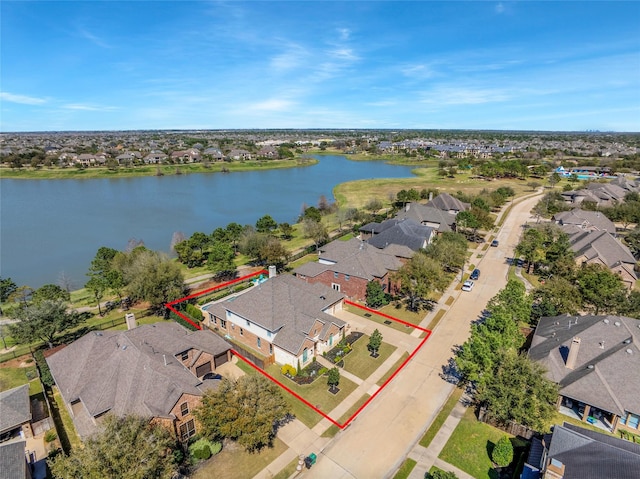 aerial view featuring a residential view and a water view