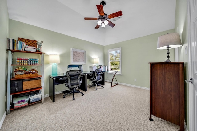 office area featuring baseboards, visible vents, carpet floors, ceiling fan, and vaulted ceiling