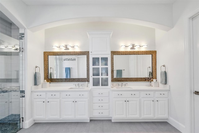 full bathroom with a shower stall and vanity