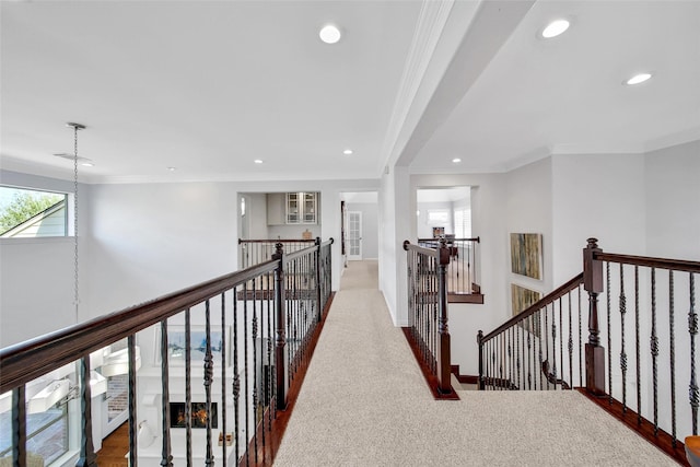 hall featuring crown molding, recessed lighting, an upstairs landing, and baseboards