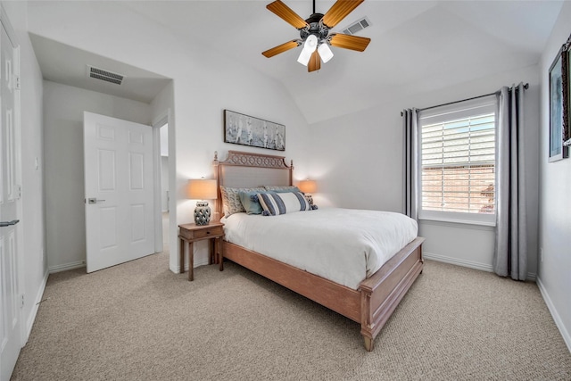 bedroom featuring lofted ceiling, baseboards, visible vents, and light carpet