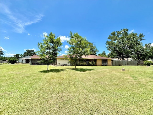 view of yard with fence