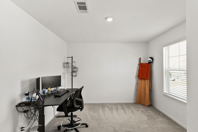 home office with visible vents, carpet floors, and baseboards