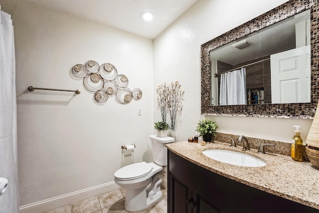 bathroom featuring tile patterned flooring, curtained shower, baseboards, toilet, and vanity