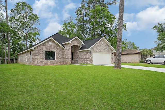 17127 Port O Call St, Crosby, TX 77532 - view of front of house with concrete driveway, an attached garage, brick siding, and a front yard