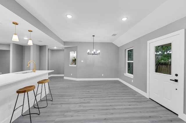 17127 Port O Call St, Crosby, TX 77532 - kitchen featuring light wood finished floors, baseboards, and a sink