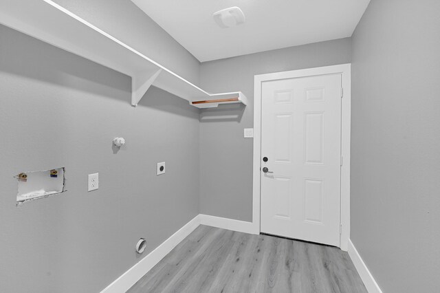 17127 Port O Call St, Crosby, TX 77532 - clothes washing area featuring light wood finished floors, baseboards, laundry area, hookup for a gas dryer, and hookup for an electric dryer