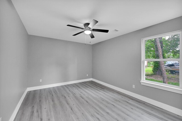 17127 Port O Call St, Crosby, TX 77532 - spare room featuring ceiling fan, visible vents, baseboards, and wood finished floors