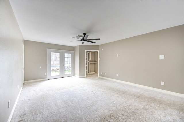 unfurnished room featuring light colored carpet, french doors, baseboards, and ceiling fan