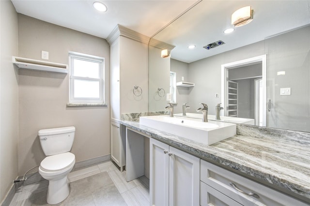 bathroom with toilet, recessed lighting, tile patterned flooring, baseboards, and vanity