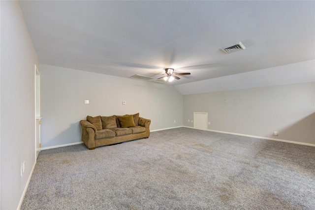 unfurnished living room featuring a ceiling fan, visible vents, baseboards, vaulted ceiling, and carpet flooring