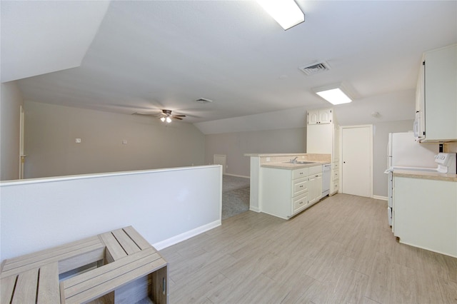 kitchen with visible vents, dishwasher, light countertops, lofted ceiling, and a ceiling fan