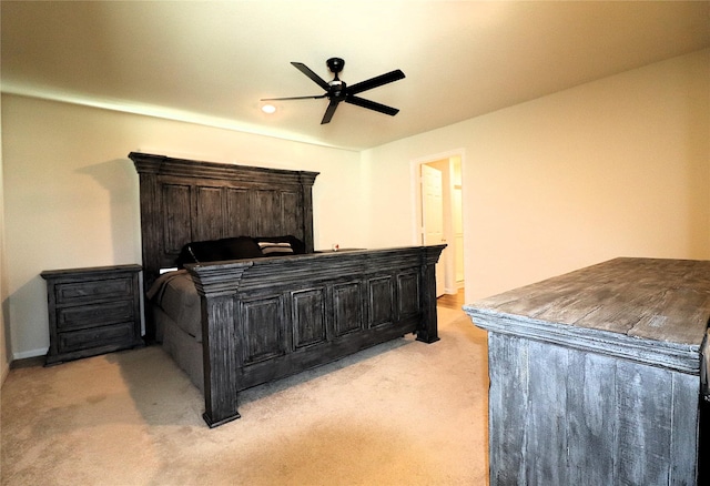 bedroom with light colored carpet and ceiling fan