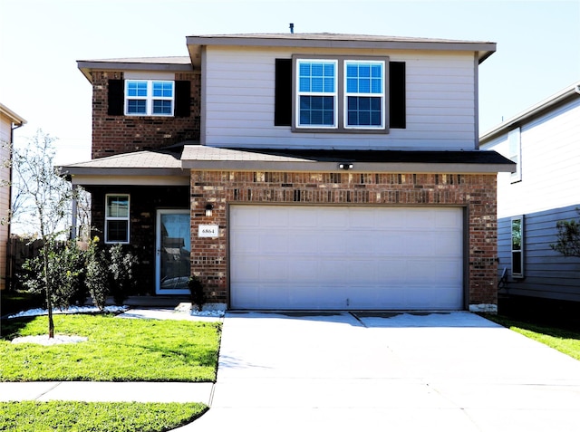 traditional-style house featuring a garage, brick siding, concrete driveway, and a front yard