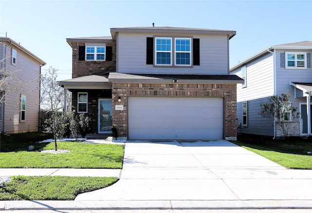 traditional home with a front lawn, concrete driveway, brick siding, and an attached garage