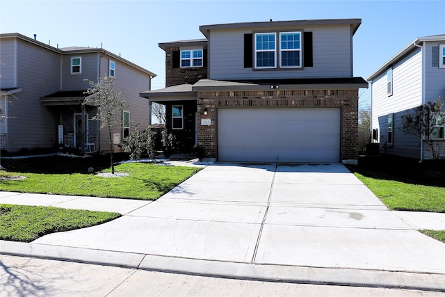 traditional home with driveway, brick siding, an attached garage, and a front lawn