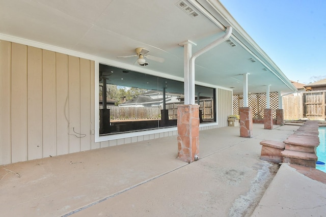 view of patio with visible vents, a ceiling fan, and fence