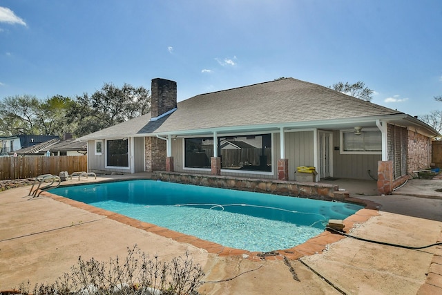 view of pool with a fenced in pool, fence, and a patio area