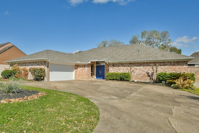 ranch-style home featuring brick siding, an attached garage, driveway, and a shingled roof