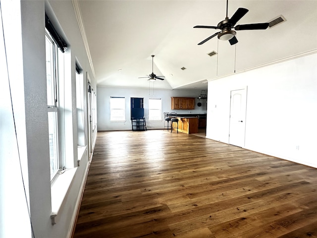 unfurnished living room featuring visible vents, ceiling fan, dark wood-style flooring, and ornamental molding