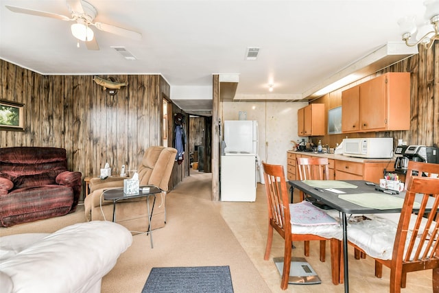16710 Kingston Way, Jamaica Beach, TX 77554 - dining room featuring wooden walls and a ceiling fan
